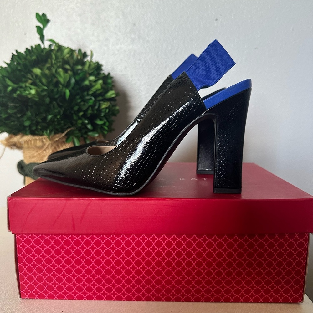 Wonderful black print with pop of color ankle strap. From day to night.